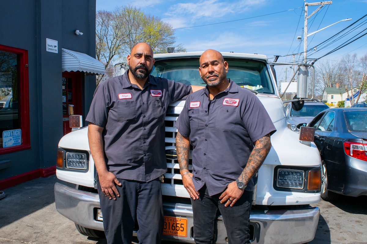 Auto technicians and owners Adolfo and Angel